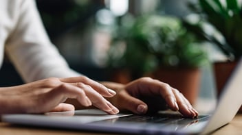 person on laptop in office