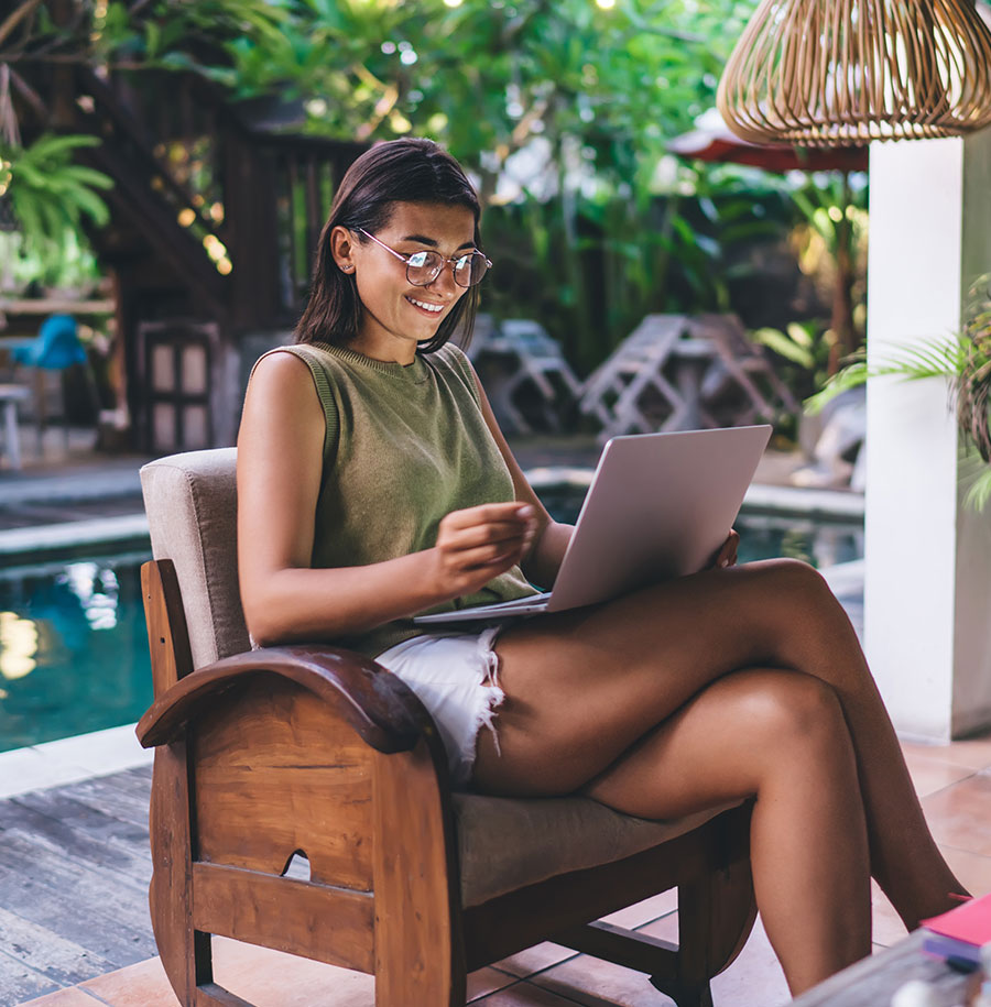 person on laptop in resort