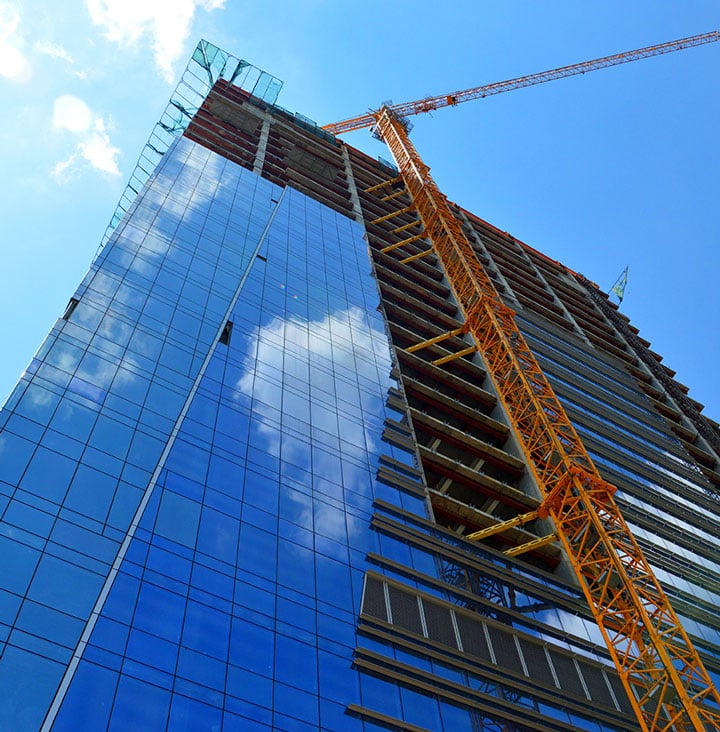 construction on apartment building with crane